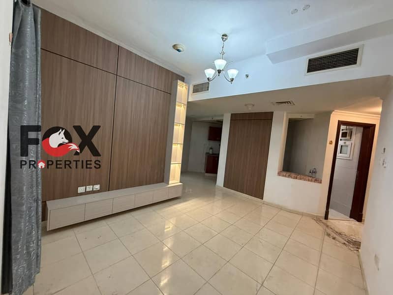 1BR for annual rent in Orient Towers, Rashidiya, Ajman. 2 baths, balcony, built-in wardrobes, free parking, gym & swimming pool.