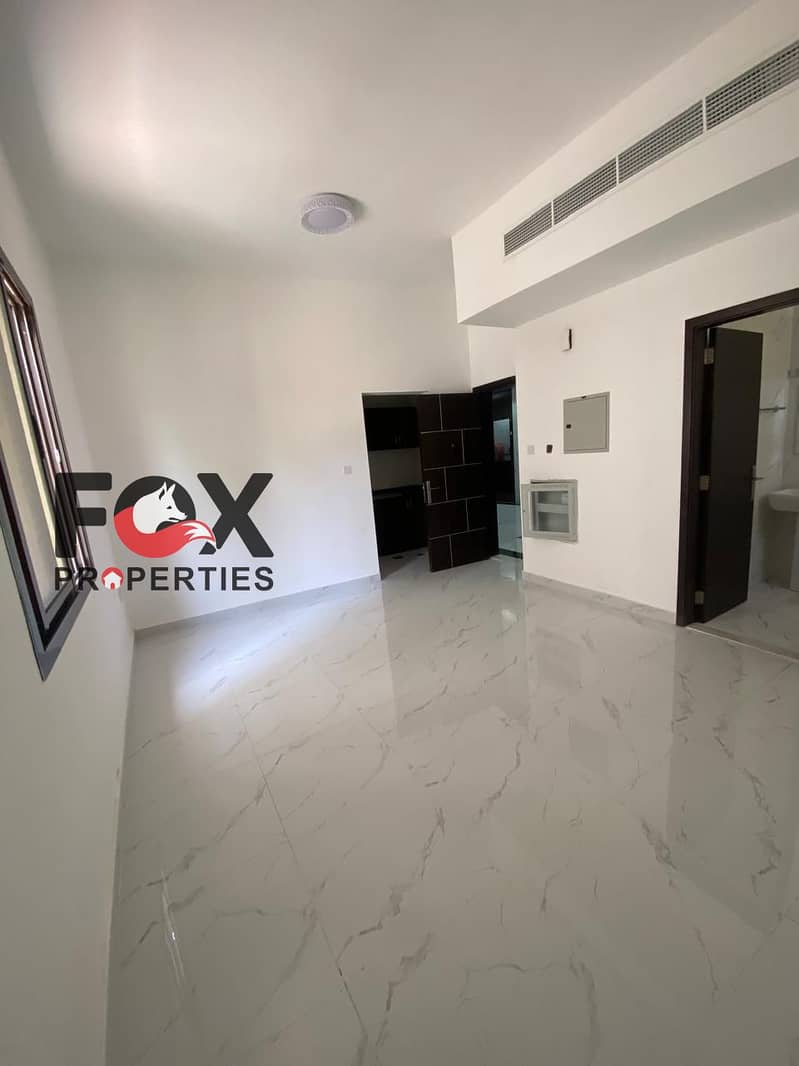 Spacious studio for annual rent | First tenant in a brand-new building | Separate kitchen | Prime location | Close to the Corniche and all amenities